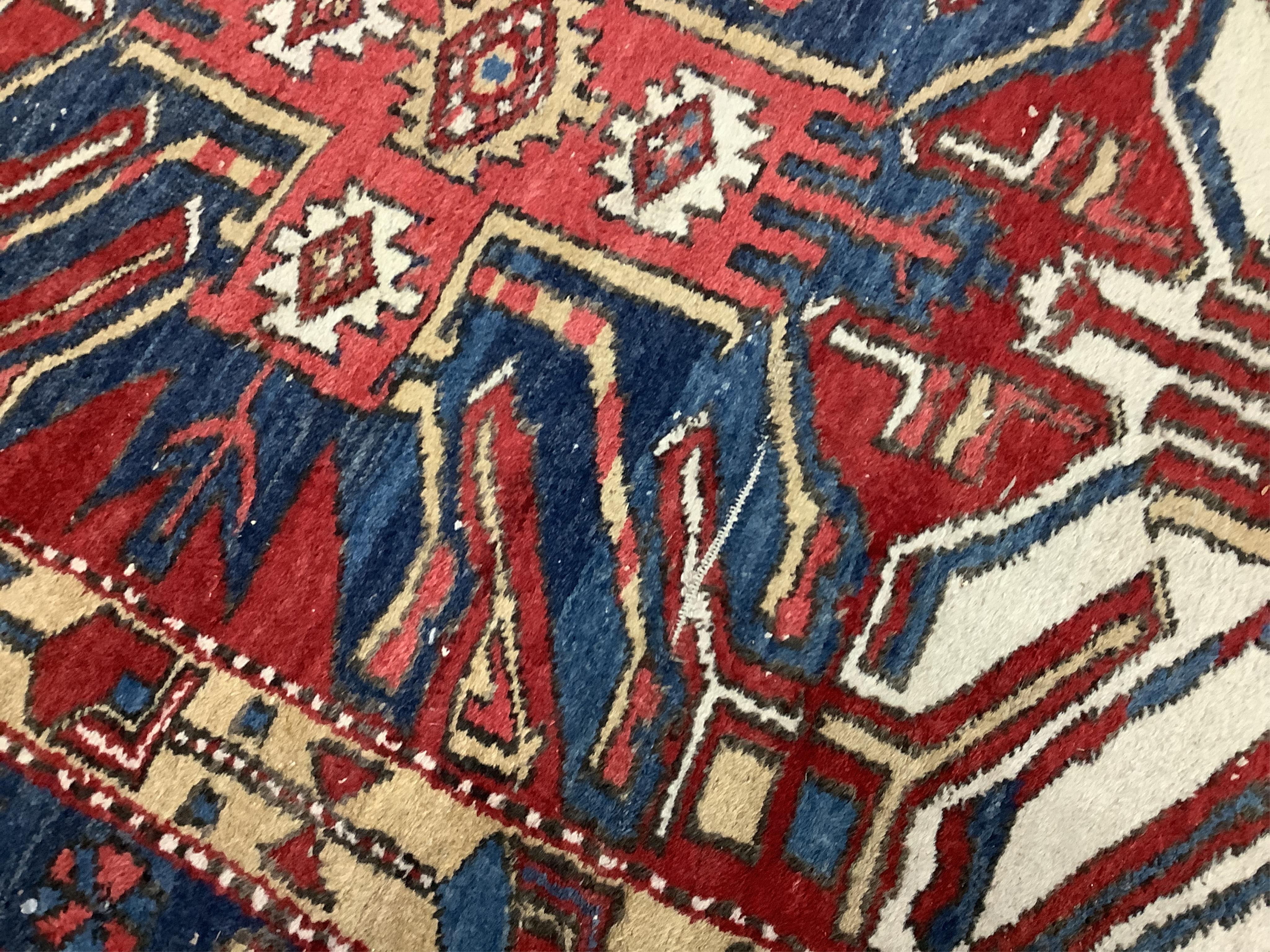 A Caucasian runner with stylised eagle motifs, 330 x 103cm